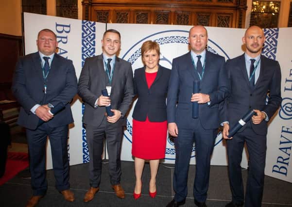 Sgt Mark Chivers, PC Chris Mains, PC Neil McBain & PC Darren Connor who helped stop and restrain a man intent on jumping from a 12th story window, putting their own lives at risk received their awards this evening during an awards ceremony at Edinburgh Castle from the First Minister 
Pic Kenny Smith,
