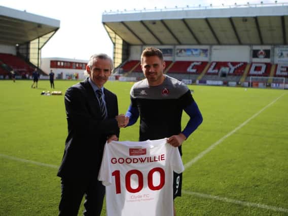 Danny Lennon presents David Goodwillie with a special jersey to mark his 100th games for Clyde (pic: Craig Black Photography).