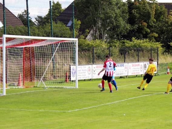 Stewarts deflected goal puts Bellshill Athletic ahead at Larkhall Thistle (Pic by Brian Closs)