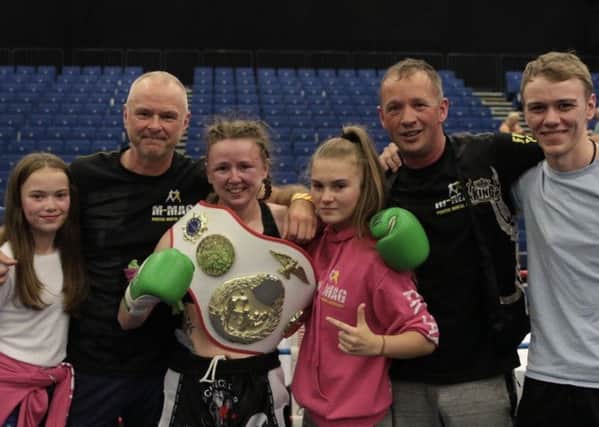 Rhona with family members and M-Mag coaches after her European title triumph.