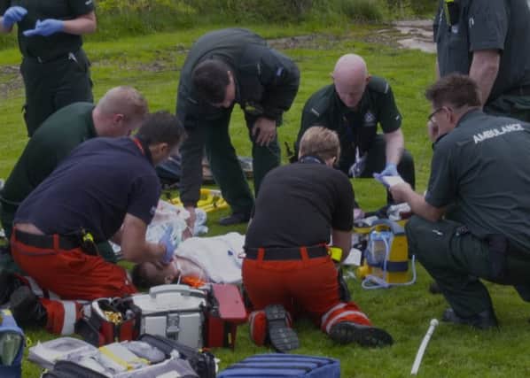 Paramedics treat Felix in  Eaglesham. (Photo: BBC Scotland).