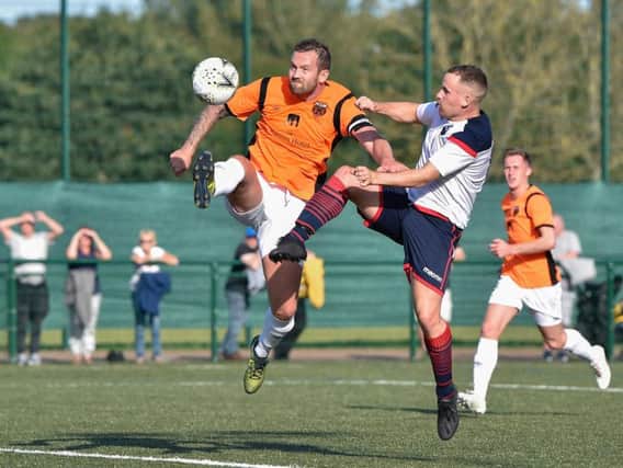 Action from Saturday's Braves-Rothes clash