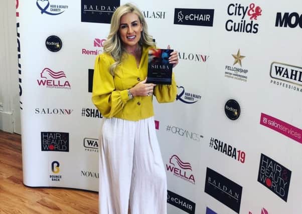 Louise with her award.