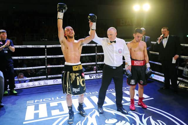 Nathaniel Collins is declared the new Celtic champion (pic: Michael Gillen)