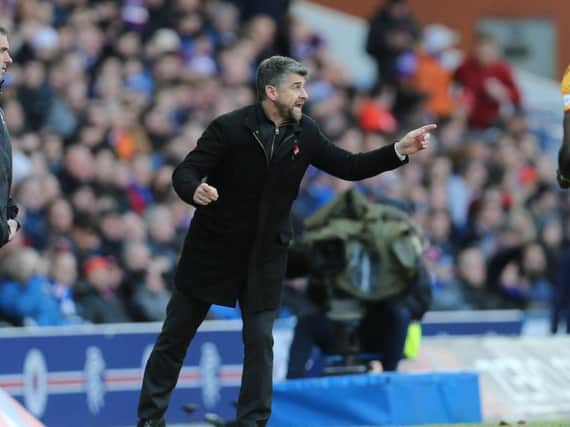 Motherwell manager Stephen Robinson encourages his players at Ibrox on Sunday (Pic by Ian McFadyen)