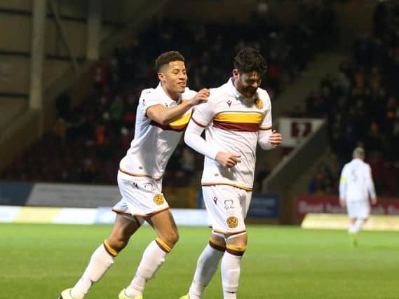 Liam Donnelly is congratulated by Jake Carroll after firing Motherwell 1-0 ahead against Kilmarnock (Pic by Ian McFadyen)