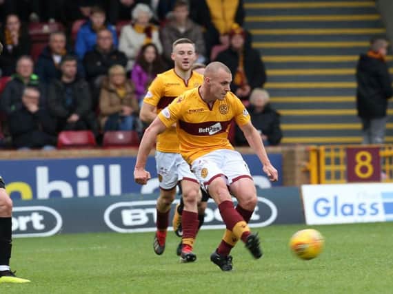 Liam Grimshaw and Allan Campbell in action against Livingston at Fir Park last season (Pic by Ian McFadyen)