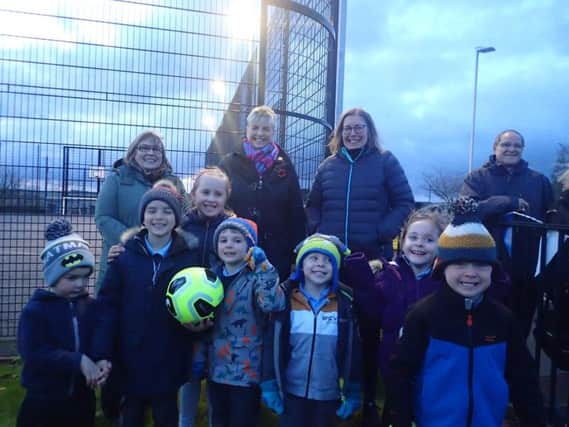 Pictured are Catherine McGurk (Levenseat Trust), Councillor Catherine McClymont, Pat Mavor (WAT IF?) and children from Auchengray Primary School.