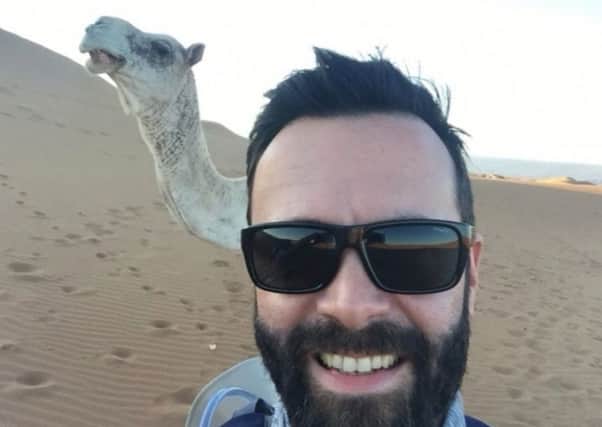 James MacKenzie pictured with one of the camels from his Saharan trek for charity.