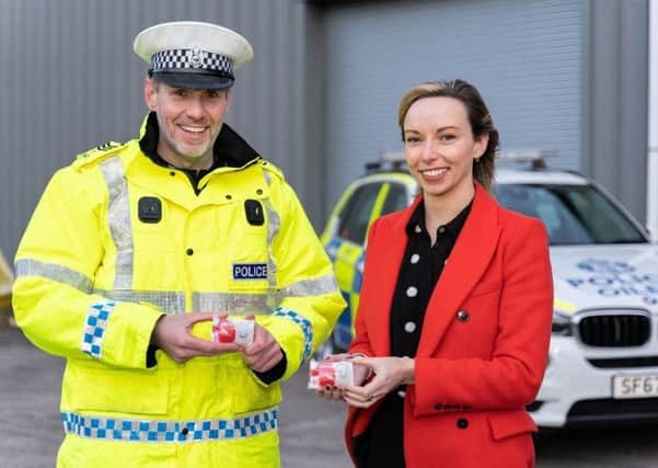 Sergeant Dominic Doyle and Jodi Gordon, partner at Cycle Law Scotland, launch the #LightUp campaign.