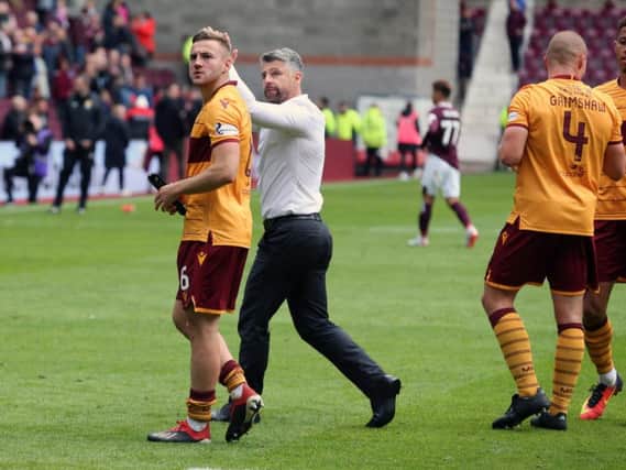 Stephen Robinson and his players celebrate after winning 3-2 against Hearts at Tynecastle in the sides' last league meeting in September.
