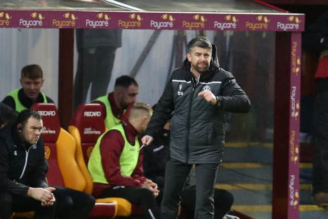 Well gaffer Stephen Robinson encourages his troops against Hearts (Pic by Ian McFadyen)