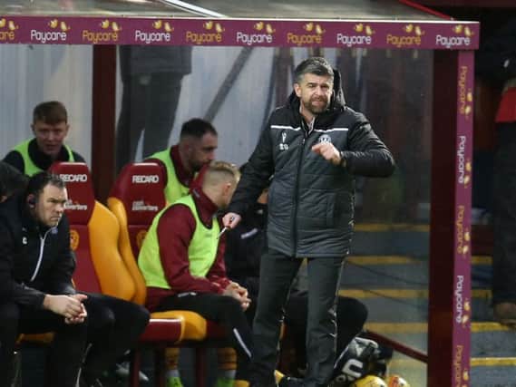 Well gaffer Stephen Robinson encourages his troops against Hearts (Pic by Ian McFadyen)