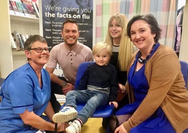 Actor Jordan Young joins nurse Fiona Todd (left), Albert Miller-Duff (4) and his mum Alison Miller-Duff, and Nuala Healy, lead for immunisation at NHS Scotland, to urge those most at risk to get vaccinated to protect them from flu.