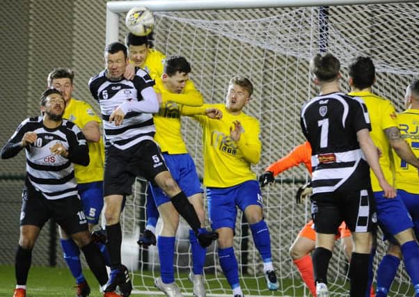 Marty Wright heads clear during an East Stirlingshire attack (pic: Alan Murray)
