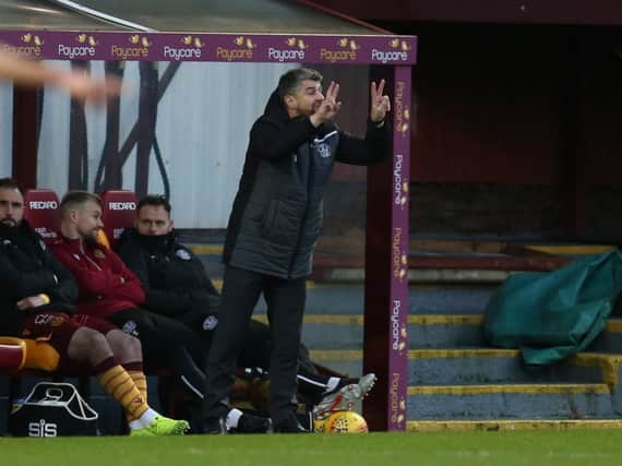 Stephen Robinson pictured in the Fir Park dugout on Sunday (Pic by Ian McFadyen)