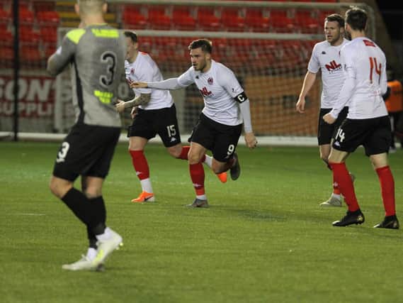 Stranraer's Jordan Allan can't believe it as David Goodwillie celebrates his third goal (pic: Craig Black Photography)