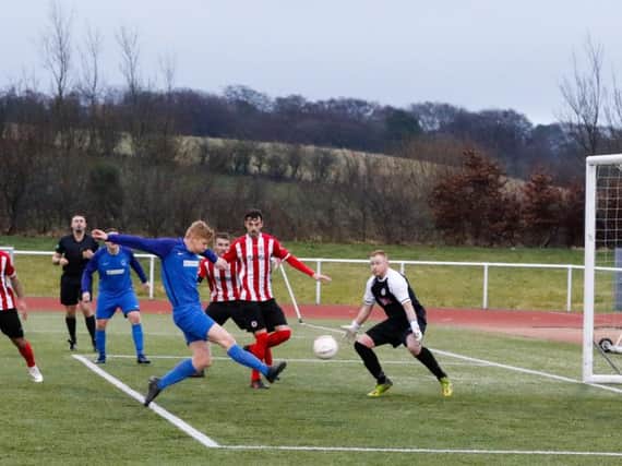 Jordan Conlon scores his hat-trick and Carluke Rovers fourth goal against Larkhall Thistle (Pic by Kevin Ramage)