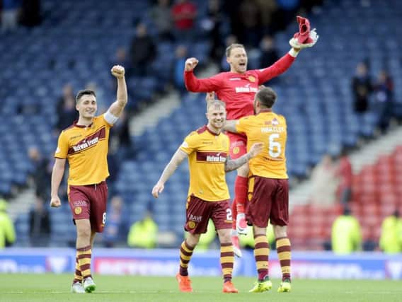 Trevor Carson celebrates Motherwell reaching the 2017 Betfred Cup final with jubilant team-mates Carl McHugh, Richard Tait and Peter Hartley (Pic by Michael Gillen)