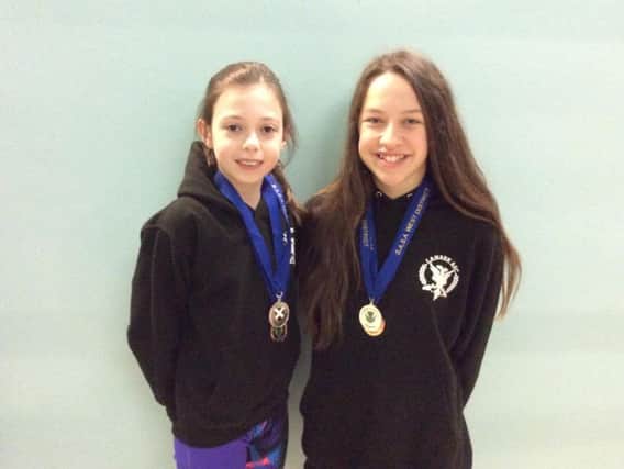 Evi Mackie and Millie McArthur were both in medal-winning form at the West District Long Course Championships