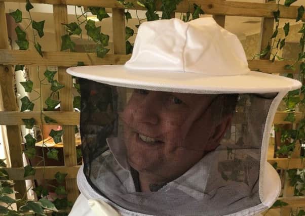 Head gardener Chris Allan suited up ready for his new visitors arriving.