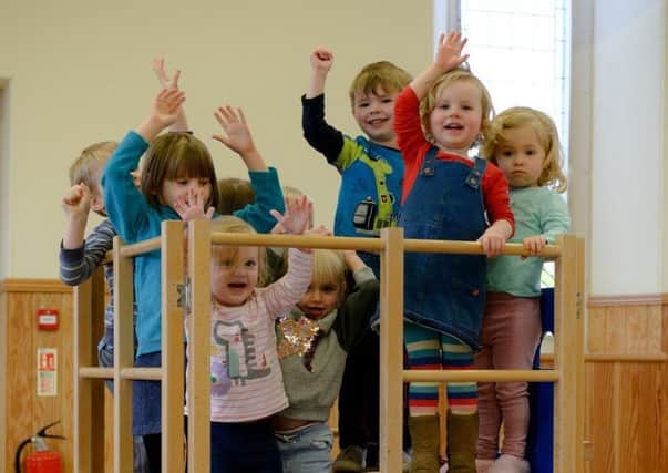 Save our playgroup say the childern of St Nicholas, at play in their church hall