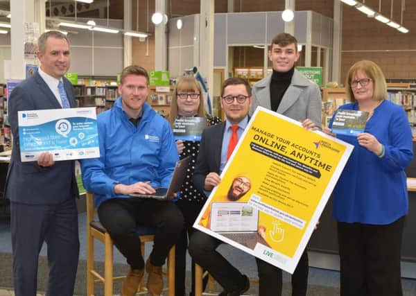 Launching North Lanarkshire Council's online portal are (l-r) Stephen Chambers (Digital Scotland), Ian Chapman (Openreach), Elaine Ford (library supervisor), Councillor Kenneth Duffy, Mackenzie McDougall (modern apprentice) and Mary McGunnigael (library assistant)