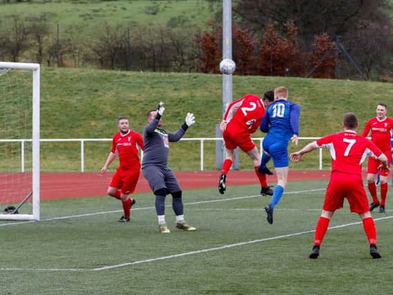 Jordan Conlon scores Carluke Rovers opening goal against Lanark United (Pics by Kevin Ramage)