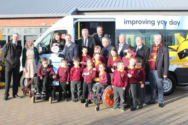 Some pupils last year with their new minibus