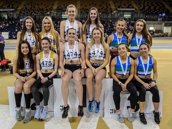 Katie and Leah (front row, left) with other medallists